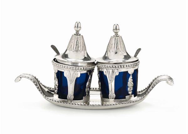 A salt and pepepr holder in molten, embossed and chiselled silver. Turin, early 19th century