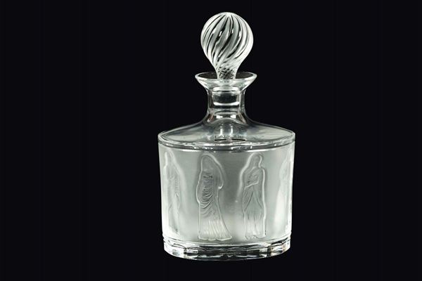 Lalique, France, 19th century. An oval bottle in clear crystal with a sanded band and a decor of classical figures