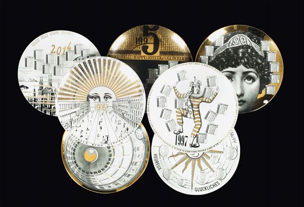 Fornasetti, Milano, 1990s. Seven plates from the Calendario series, 1990 to 2017, decorated porcelain