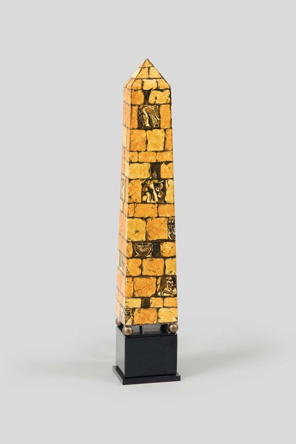Piero Fornasetti, Milan, 1970s. An obelisk-shaped lamp in decorated metal, plexiglass shade