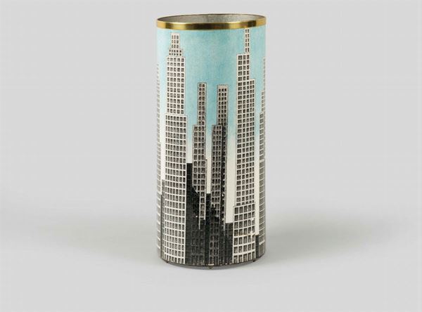 Fornasetti, Milan, 1980s. A cylindric metal umbrella stand with a decor of skyscrapers. Brass band