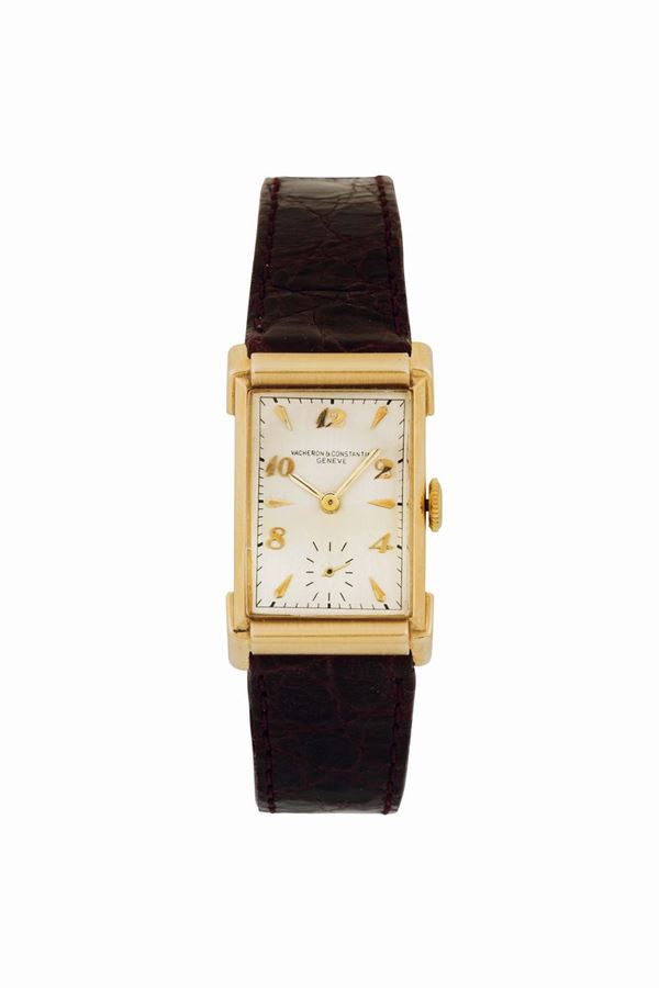 VACHERON & CONSTANTIN HOODED LUGS, No. 472977, case No. 802946. Very fine and elegant, rectangular curved, 14K yellow gold wristwatch with gold buckle.Made circa 1946. Accompanied by a Vacheron Constantin box