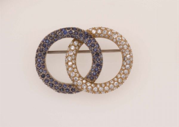 A diamond, sapphire and gold brooch