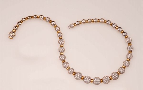 Diamond and gold necklace. Designed as a graduated series of spheres pavé-set with brilliant-cut diamonds