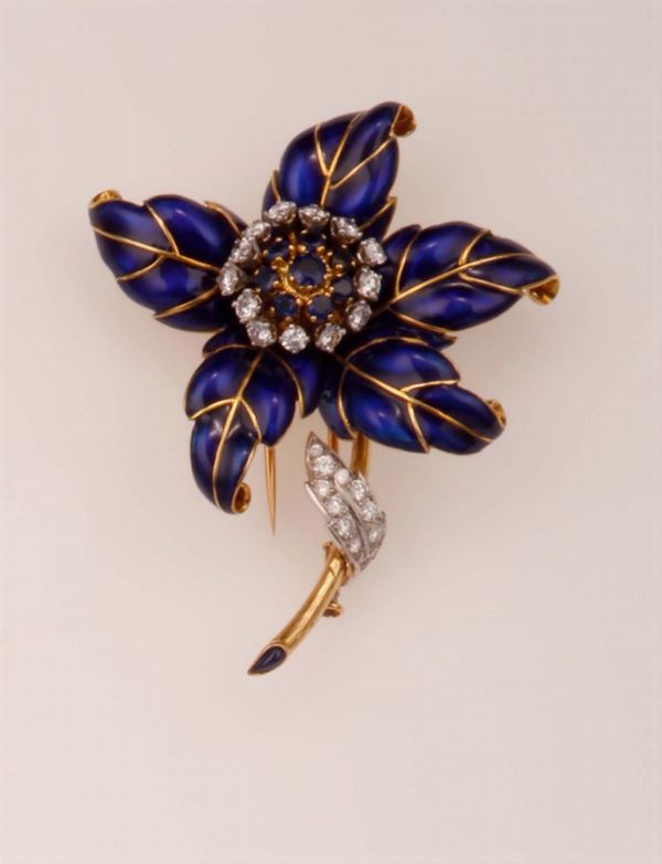 Enamel, diamond and sapphire brooch. Designed as a flower. Signed Garrard