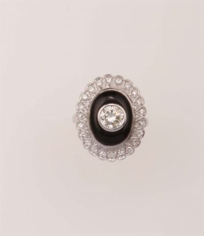 Anello con Diamante Taglio Brillante di Ct 0,95 ed Onice