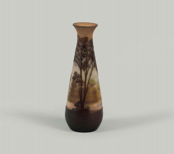 Gallé, France, 1900 ca. A drop-shaped vase in blown glass with a cameo decor of an autumn landscape