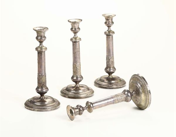 Quattro candelieri in metallo argentato, XIX secolo