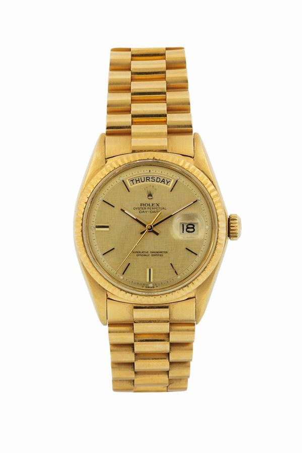 Rolex, Oyster Perpetual, Day-Date, Superlative Chronometer Officially Certified, case No. 2073552, Ref. 1803.  Fine and rare, self-winding, water-resistant, 18K yellow gold wristwatch with day and date with a Rolex 18K yellow gold Rolex President bracelet with original deployant clasp Accompanied by the COSC, instruction booklet and papers. Made circa 1969