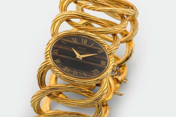 PIAGET, TIGER'S EYE DIAL, raro e raffinato, orologio da polso, in oro giallo 18K con bracciale integrato in oro. Realizzato nel 1970 circa