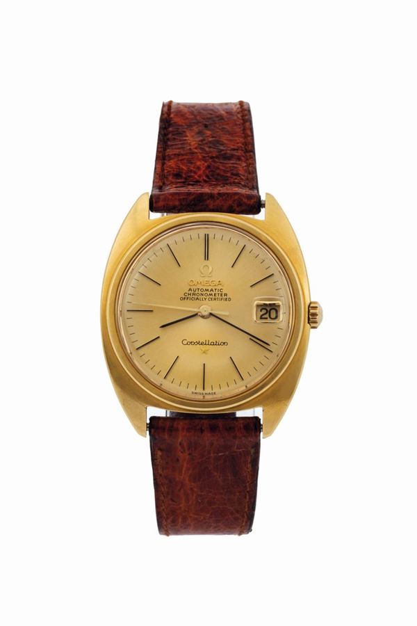 Omega, Constellation, Automatic, Chronometer, Officially Certified,  Ref. 168009. Fine, tonneau-shaped, water-resistant, self-winding, center seconds, 18K yellow gold wristwatch with date and a gold plated Omega buckle. Made circa 1968