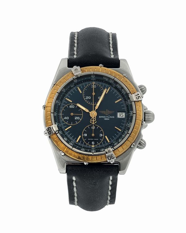 Breitling, Chronomat Automatic, case No. D13047, Ref. 81950. Fine, water-resistant, stainless steel and 18K yellow gold wristwatch with round button chronograph, 18K yellow gold bezel, registers, tachometer, date and a stainless steel Breitling  buckle. Made circa 1980