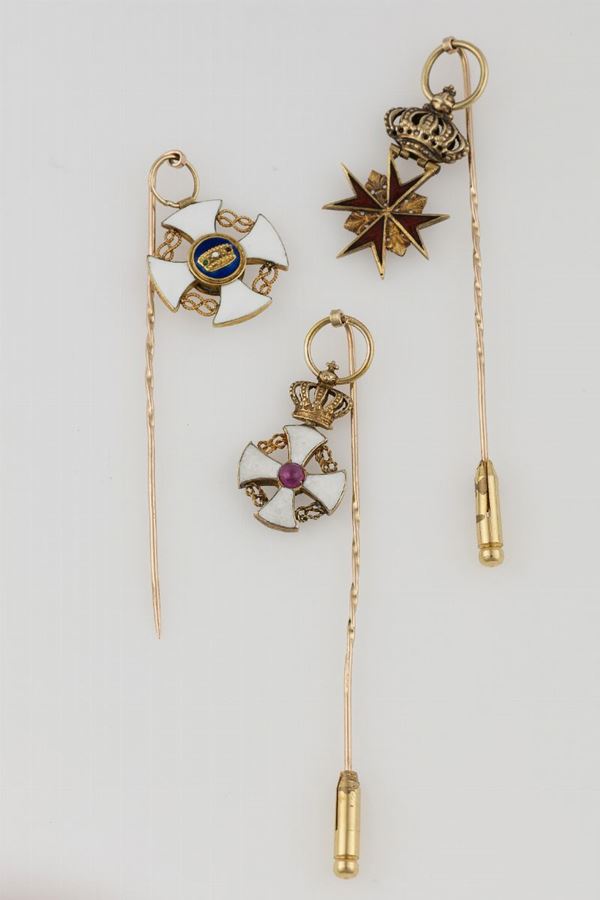 Three gold and enamel brooches