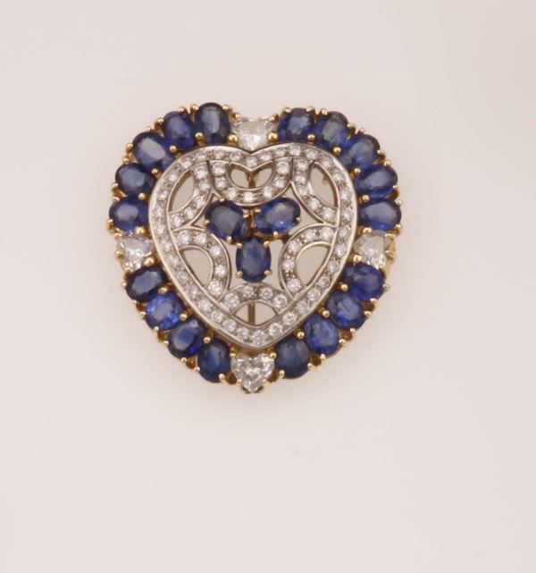 Sapphire and diamond brooch/pendant. Designed as a heart. Signed Moroni