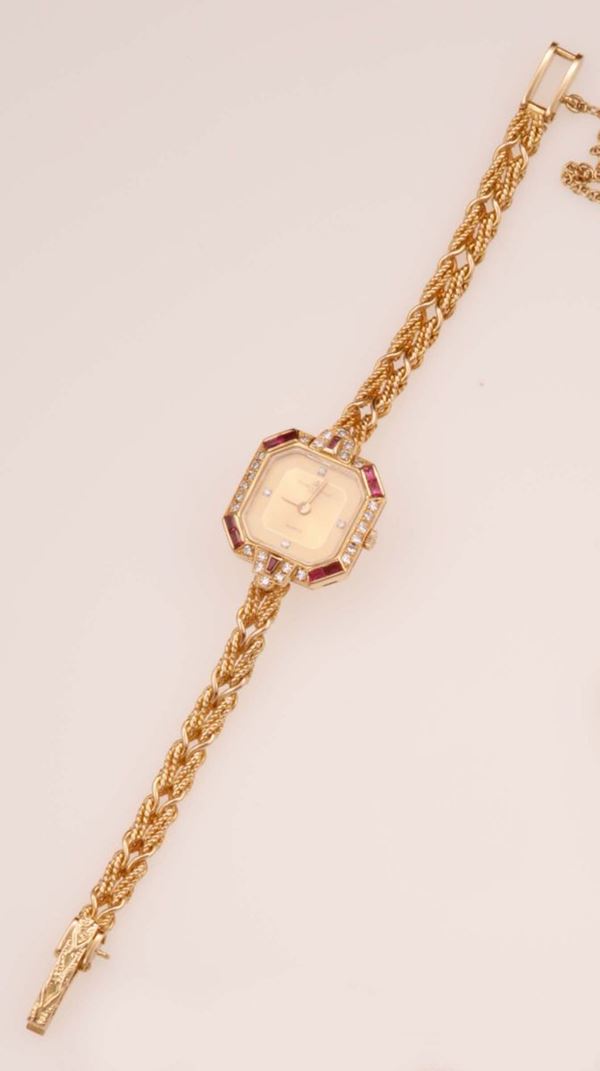 Baume & Mercier. A lady's yellow gold, diamond and ruby watch