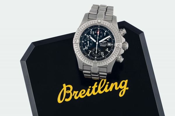 Breitling, Chronograph - Chronometer - Automatic, Ref. E 13360. Fine, large, water resistant, titanium, self winding wristwatch with round button chronograph, registers, date and a titanium Breitling link bracelet with deployant clasp. Accompanied by the original fitted box, Chronometer Certificate, Guarantee and instruction booklet. Sold in 2001