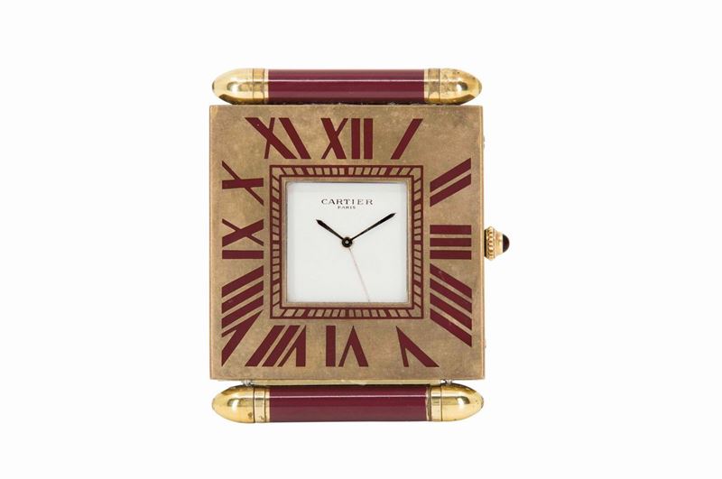 CARTIER, piccolo orologio da tavolo, con sveglia, in ottone dorato, in stile Art Deco. Realizzato nel 1980 circa  - Asta Vintage, Gioielli e Orologi - Cambi Casa d'Aste