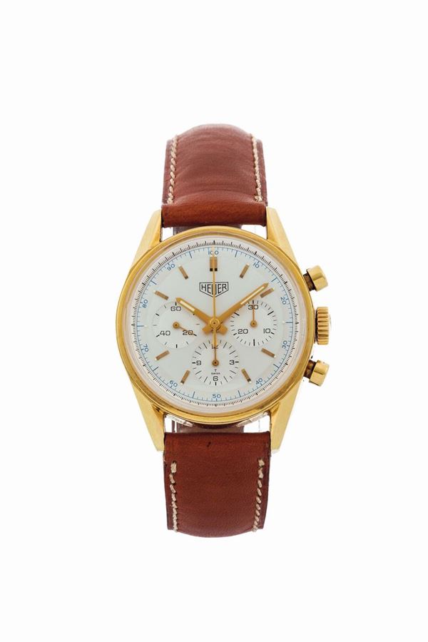 Heuer, Chronograph, Carrera, 1964 re-edition, No. 1026, Ref. CS3140. Fine, water resistant, 18K yellow gold wristwatch with round button chronograph, registers and a Heuer 18K yellow gold buckle. Made in a numbered series circa 1996.