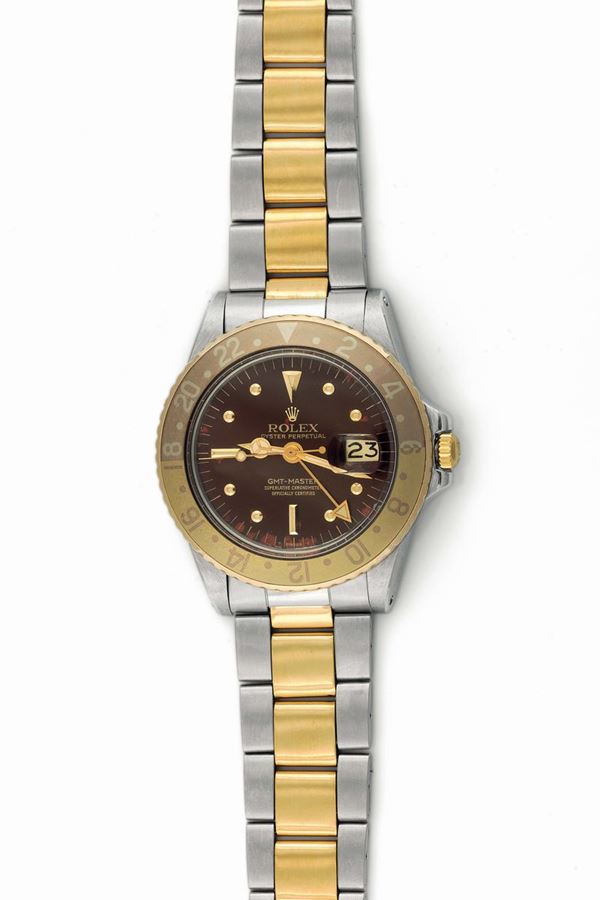 Rolex,  Oyster Perpetual, GMT-Master, Superlative Chronometer, Officially Certified , case No.2731283, Ref. 16753, Root beer nipple Dial. Fine, two-time-zone, center seconds, self-winding, water resistant, stainless steel and 18K yellow gold wristwatch with date, special 24-hour gold and bronze bezel and hand and a stainless steel and 18K yellow gold Oyster bracelet. Made in 1971