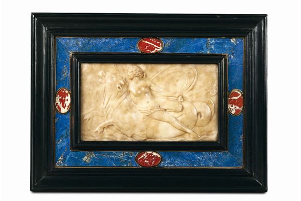 A Nereid on sea bull, an alabaster relief within a frame in ebonised wood and hardstone. From the circle  [..]