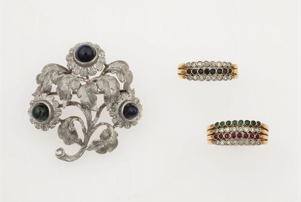 Two gold rings and one gold brooch