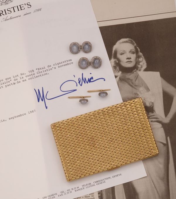From the collection of Miss Marlene Dietrich: a pair of star sapphire and diamond cluster cufflinks with a pair of dress studs en suite. A gold cigarette case with sapphire push-piece. Each lot is sold with a letter signed by the artist