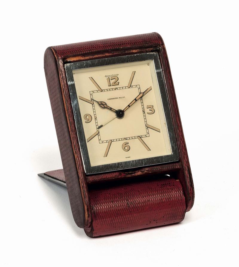 Jaeger LeCoultre, Eberhard Milan. Piccolo orologio da tavolo in acciaio e pelle con sveglia. Realizzato nel 1960 circa  - Asta Orologi da Polso e da Tasca - Cambi Casa d'Aste
