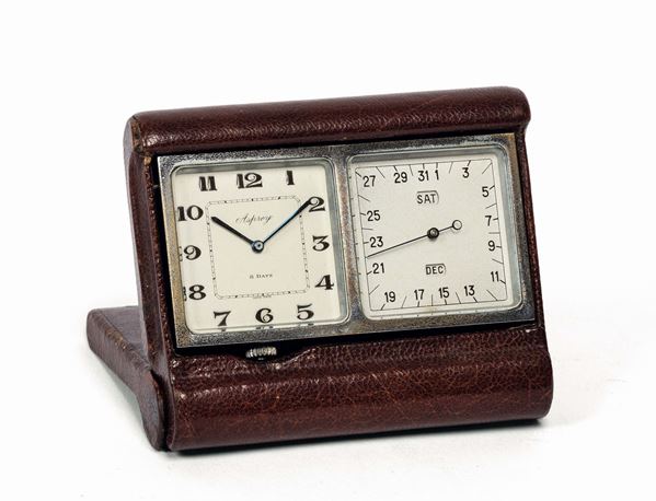 ASPREY. Fine, small metal and leather desk clock with triple calendar. Made circa 1940