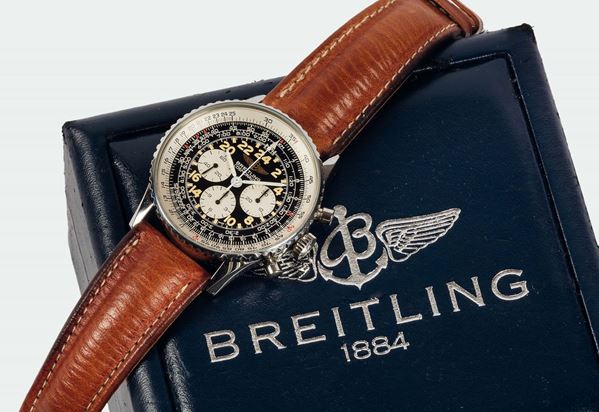 BREITLING, Geneve, Navitimer-Cosmonaute, Ref. A12019. Fine, water-resistant , stainless steel  wristwatch with 24- hour dial, round button chronograph, registers, telemeter, slide-rule and a stainless steel Breitling buckle. Accompanied by the original box, papers and Guarantee. Made in the  1990's.
