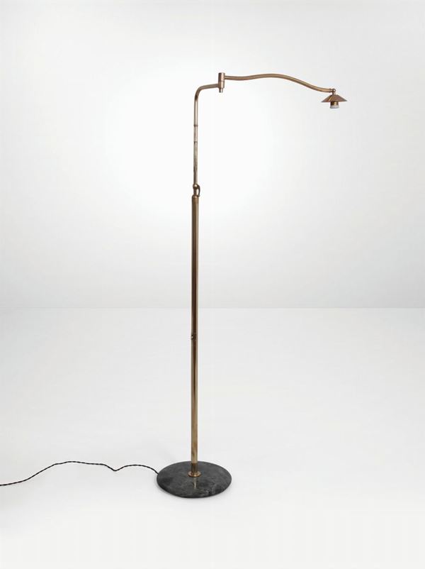 An adjustable and extendable reading lamp with a brass structure and a marble base. Italy, 1950 ca.
