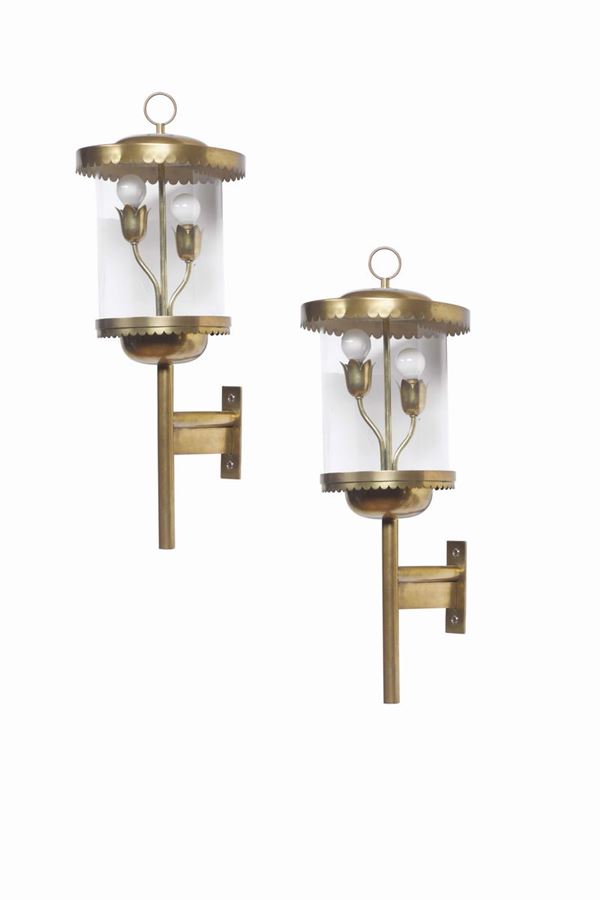 A pair of large wall lamps with a brass structure and glass diffusers. Italy, 1950 ca.