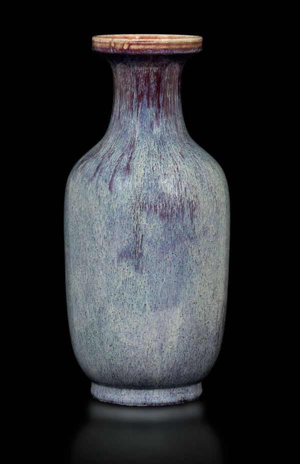 A flambé porcelain bottle-shaped vase in purple hues, China, Qing Dynasty, 19th century