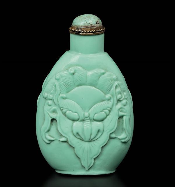 A turquoise snuff bottle embossed with monkey's heads, China, Qing Dynasty, 19th century