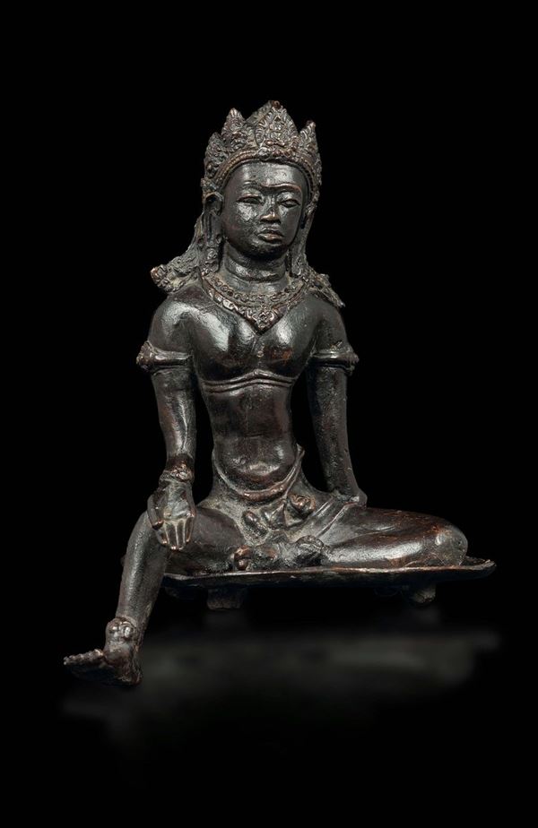 A bronze sculpture depicting a seated Maitreya, South-Eastern Asia, 19th century