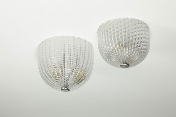 Venini, a pair of plafond lamps with a metal structure and Murano glass shades. Venini Prod.). Italy, 1950 ca.