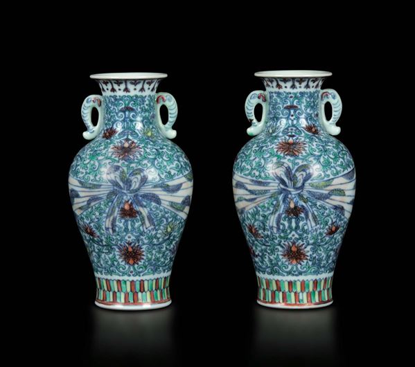 A pair of small double-handled doucai porcelain vases with a central ribbon decor, China, Qing Dynasty, 20th century