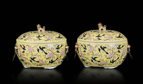 A pair of porcelain bowls with lid with a decor of swallows and cherry blossoms on a yellow backdrop, China, Qing Dynasty, Guangxu Period (1875-1908)