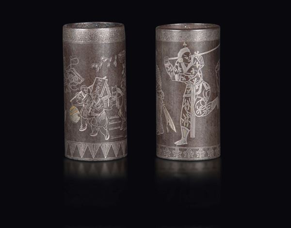 A pair of round metal brush holders with silver thread inlays depicting warriors, China, Qing dynasty, likely Qianlong period