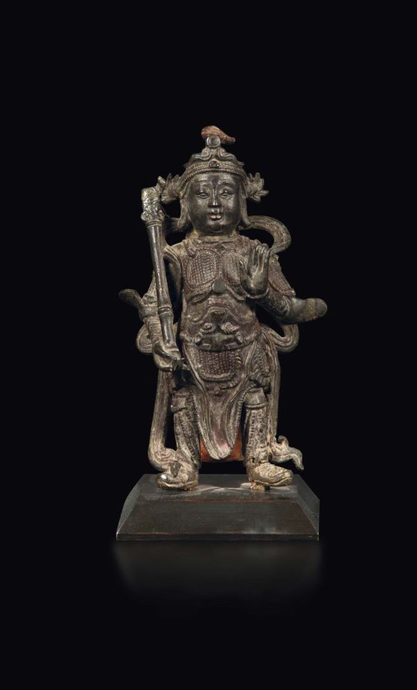 A semi-gilt bronze sculpture with traces of polychromy depicting Guandi, China, Ming Dynasty, 17th century