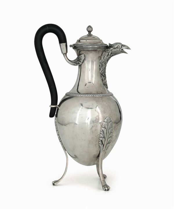 A large coffee pot in molten, embossed and chiselled silver, ebonised wood handle. Stamp in use during Napoleon's domination from 1805 to 1814