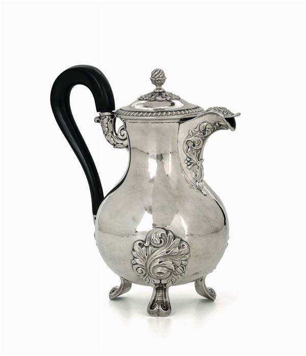 A molten, embossed and chiselled silver coffee pot, fitted handle in ebonised wood. Paris, marks in use from 1819 to 1838 and silversmith's marks (unidentified)