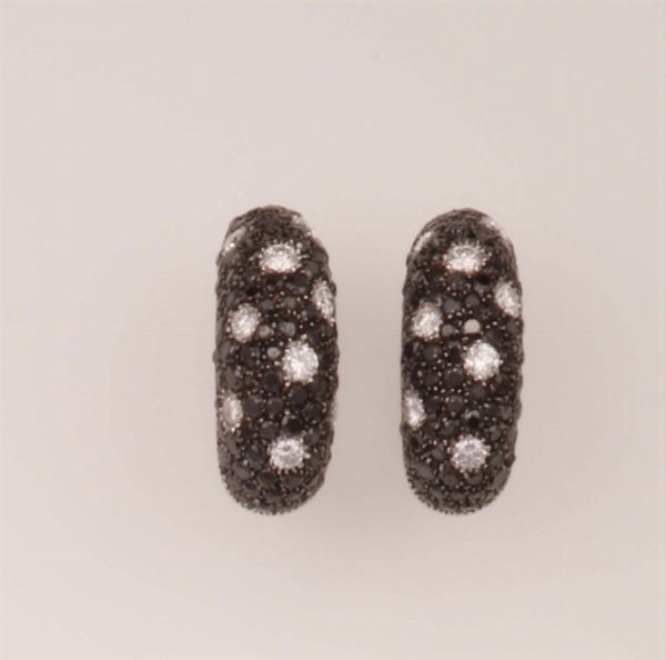 Pair of diamond earrings. Signed De Grisogono