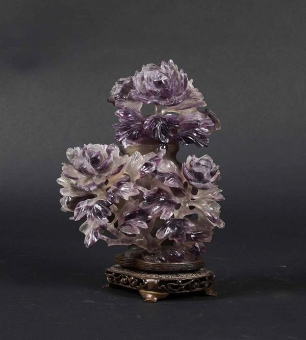 A carved amethyst vase and lid with blossoming peonies, China, Qing Dynasty, early 20th century