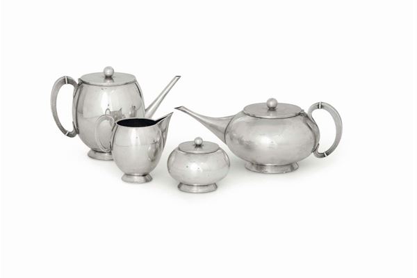 A silver service made up by a teapot, a coffee pot, a milk jug and a sugar bowl. Silversmith Genazzi, Milan 20th century