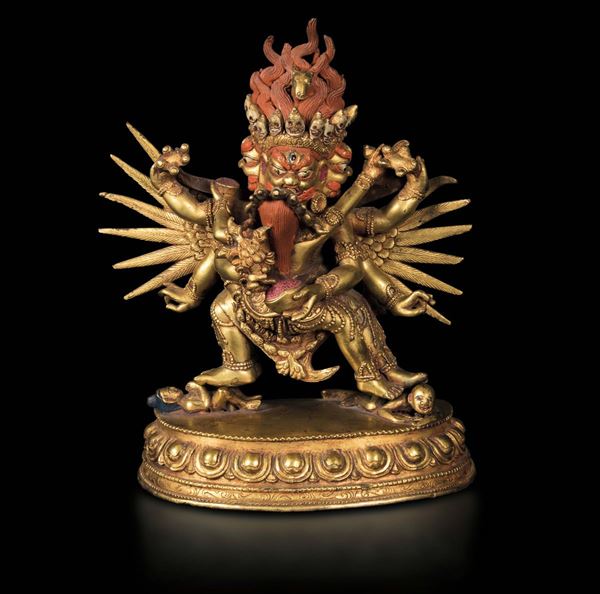 A gilt bronze figure of Mahakala on a lotus flower, Tibet, 19th century