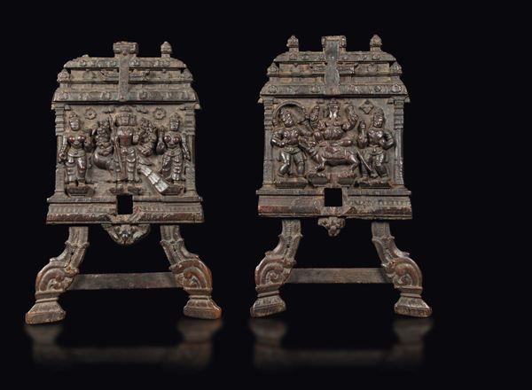 A pair of sedan chair heads in carved wood with deities, India, 18th-19th century