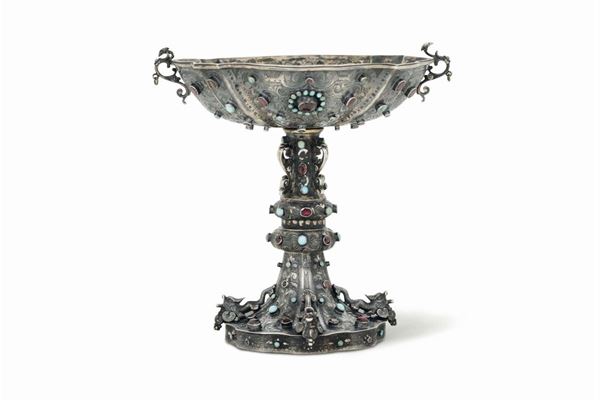A cup in molten, embossed, chiselled and gilt silver and settings with garnets and turquoises, Austria (?) 19th-20th century