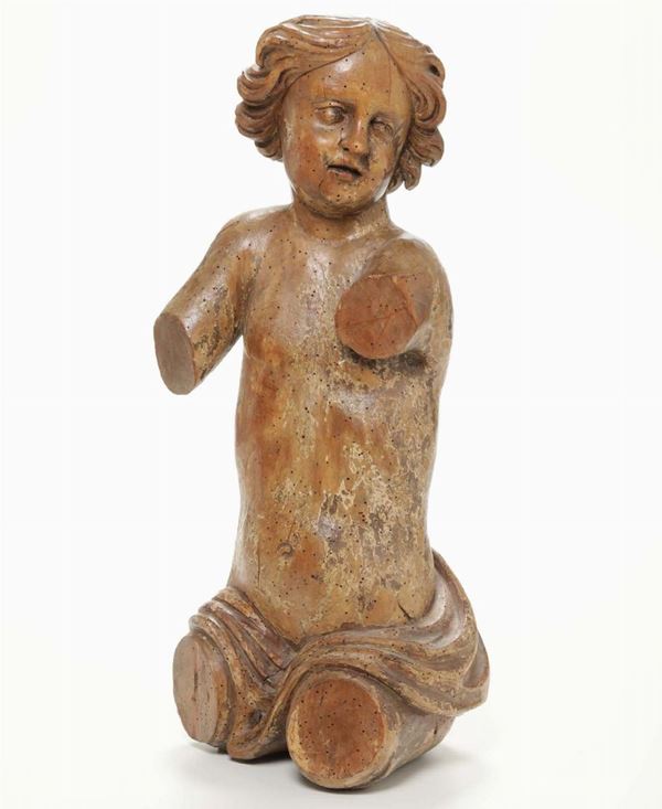 A ligneous fragment depicting a putto. Baroque sculptor from the 17th century