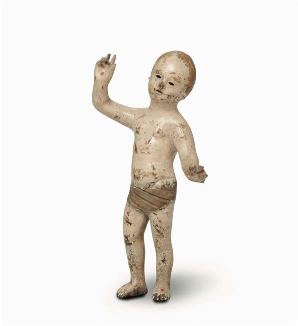 A childlike figure in polychrome wood. Sculptor from the 18th-19th century