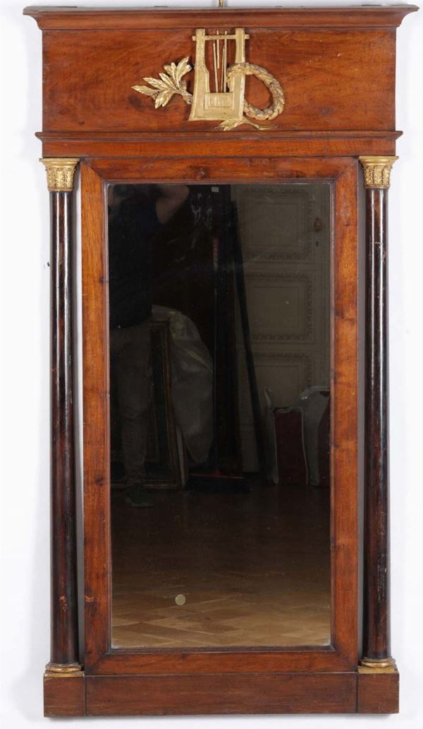 A veneered Empire mirror, 19th century